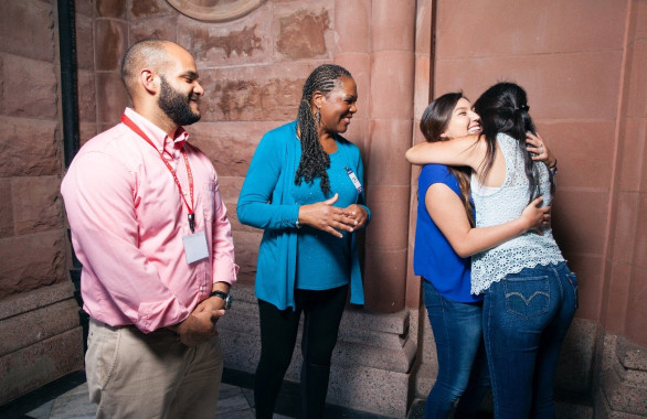 Casa People Hugging in a Room During Reunion